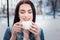 Portrait of delighted girl that smelling good coffee