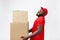 Portrait of delivery african american man in red shirt. he lifting heavy weight boxes against having a isolated on the