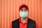 Portrait of delivery man wearing face protective mask for coronavirus spread prevention - Courier at work during covid 19 pandemic