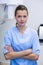 Portrait of dental assistant standing with arms crossed