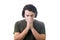 Portrait of depressed young man keeps hands together as prayer, eyes closed, head down over white background. Desperate guy