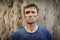 Portrait of determined man standing during obstacle course