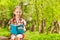 Portrait of diligent schoolgirl reading book