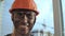 Portrait Dirty Building Worker Background Construction Crane. Handsome Caucasian Man in Hard Hat Smiles. People Working Equipment