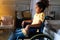 Portrait of disabled black girl with wheelchair at home