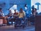 Portrait of disabled businesswoman in a wheelchair in front of her diverse business team at office