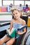 Portrait of disabled school girl reading book in library