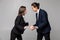 Portrait of displeased angry quarrel business colleagues couple isolated over white wall background