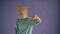 Portrait of displeased person with paper bag on head showing thumbs-down gesture