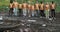 Portrait of diverse eco activists wearingt shirts with recycling symbol looking to camera. Group of people standing in