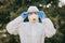 Portrait of doctor epidemiologist fighting with coronavirus COVID-19. Protection mers by virologist. White medical suit