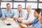 Portrait of doctors smiling in conference room