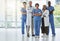 Portrait, doctors and team of nurses with arms crossed standing together in hospital. Face, confident and medical