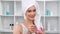 Portrait domestic girl in towel mixing moisturizing mask. 4k Dragon RED camera
