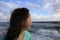 Portrait of down syndrome girl smiling on background of the sea