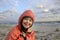 Portrait of down syndrome girl smiling on background of the sea