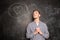 Portrait of dreaming guy to fall in love on black chalkboard