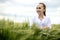 Portrait of Ecologist or biologist in a white coat and glasses examining plants