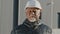 Portrait of elderly african american confident man professional engineer construction worker in safety helmet successful