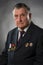 Portrait of an elderly gray haired man. On his chest medals of the Soviet period. A war veteran and hero of socialist labor.