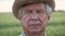 Portrait Of Elderly Man With Tanned Wrinkled Face Looking At Camera In Outdoor