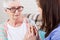 Portrait of an elderly woman holding the hands of a rehabilitologist nurse close up