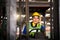 Portrait of an electrician working in an industry. Staff driving a forklift in an industrial factory