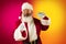 Portrait of emotional Santa Claus wishes wealth and prosperity to every family in New Year 2022. Holidays concept