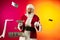 Portrait of emotional Santa Claus wishes wealth and prosperity to every family in New Year 2022. Holidays concept