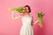 portrait of emotional woman with bouquets of pink tulips