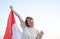 Portrait of an emotional woman with the flag of France. Football fan. Olympic fan