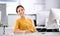 Portrait, employee and woman at a desk, computer and thinking with internet and brainstorming with decision. PR agency