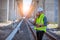 Portrait engineer under inspection and checking construction process railway and checking work on railroad station .Engineer weari