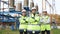 Portrait engineers or architects crossing arms and looks at the camera. Workers wearing safety uniform and hard hat with