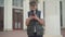 Portrait of engrossed schoolboy messaging online. Absorbed Caucasian boy using social media on smartphone standing