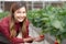 Portrait entrepreneur beautiful young asian woman check strawberry with cultivation with happiness in farm.