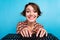 Portrait of excited cheerful lady beaming smile arms press write keyboard button isolated on blue color background