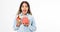 Portrait of an excited cute black girl holding opened present box isolated over white background