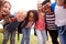 Portrait Of Excited Elementary School Pupils On Playing Field At Break Time