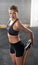 Portrait, exercise and woman stretching legs in gym for fitness, training and workout practice for healthy body wellness