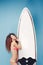 Portrait exotic girl posing with surfboard