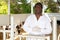 Portrait of an experienced african american male veterinarian standing on a livestock farm