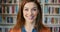 Portrait, face and books with a woman at work in a bookstore, library or research center with a smile. Student, school