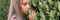 portrait face of candid offended upset little kid girl of eight years old with long blond hair