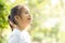 Portrait face of cute asian little girl and child happiness and fun in the park in the summer