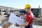 Portrait of factory worker on building site background