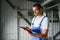 Portrait of factory worker. Young handsome factory worker