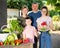 Portrait of family with children in the backyard of country house