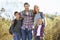 Portrait Of Family Hiking In Countryside