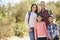 Portrait Of Family Hiking In Countryside